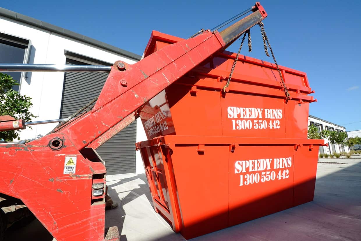 Skip bin being loaded at Speedy Bins truck for Sunshine Coast skip bins for hire order